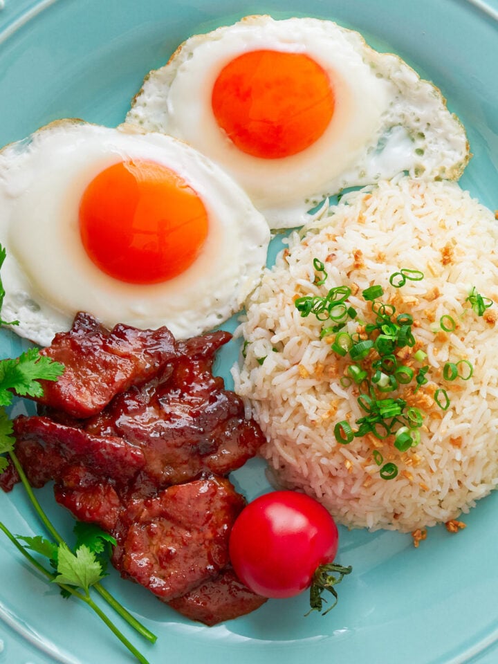 The Best Tosilog Recipe, with home-cured Tocino (Filipino Bacon), Sinangag (garlic fried rice), and sunny side up eggs.