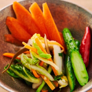 Making Tsukemono or Japanese Pickles is a great way to preserve fresh veggies. In this recipe, we cover Asazuke (fresh pickles), Shiozuke (salt pickles), and Shoyuzuke (soy sauce pickles).