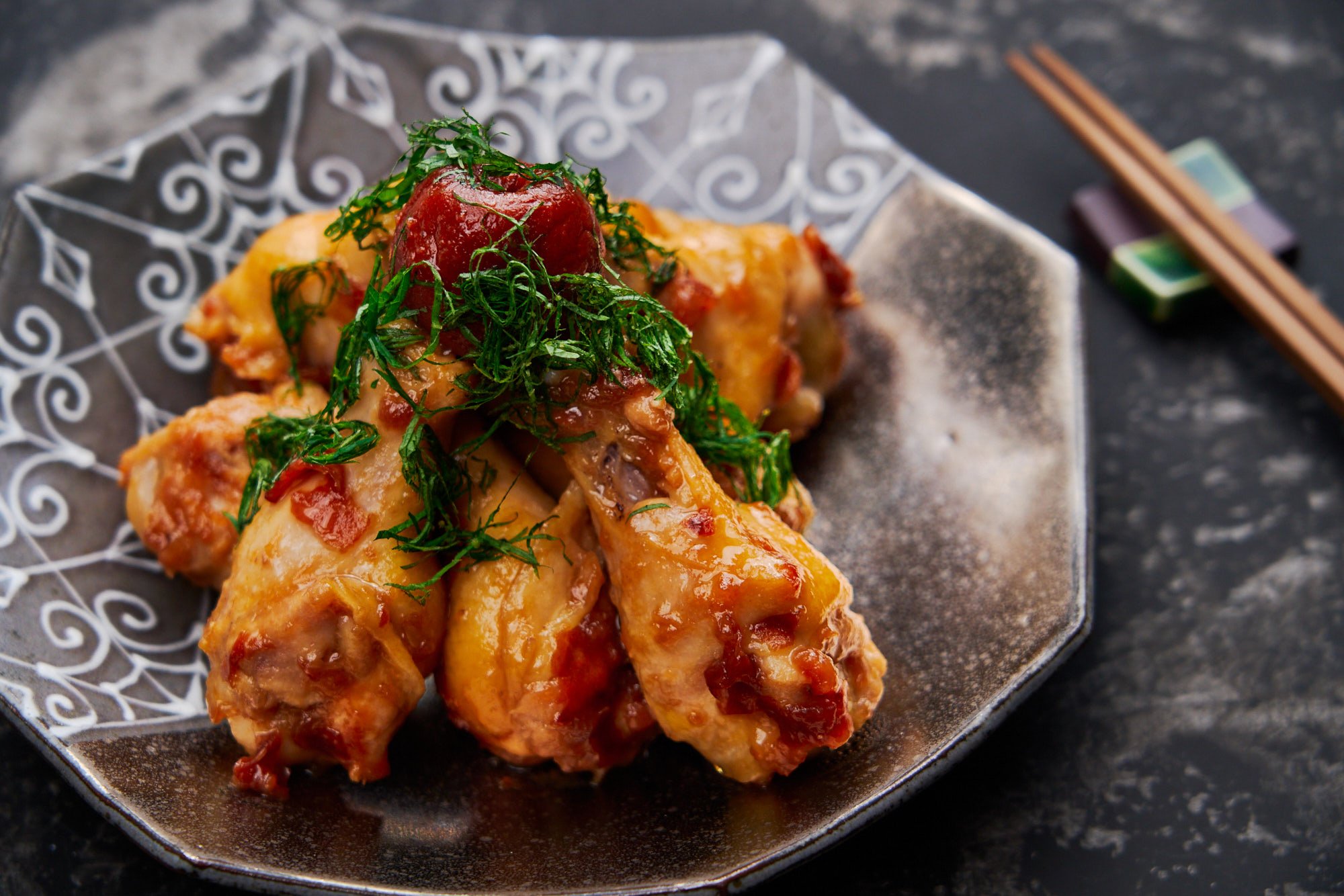 Chicken wings braised with tangy pickled plums make for a delicious Japanese appetizer called umeboshi chicken.