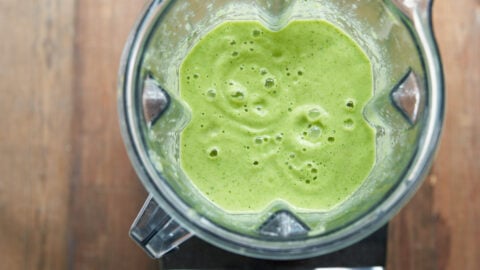 Pureed broccoli cheese soup in a Vitamix blender.