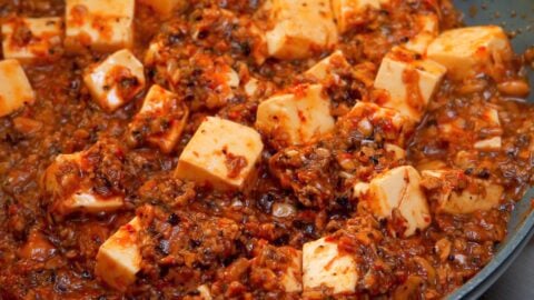 Vegan Mapo Tofu simmer in a frying pan.