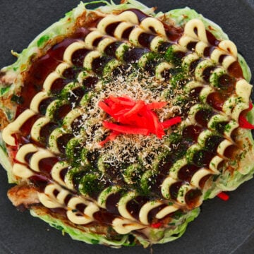 This delicious plant-based Okonomiyaki is loaded with cabbage, scallions and shiitake mushrooms.