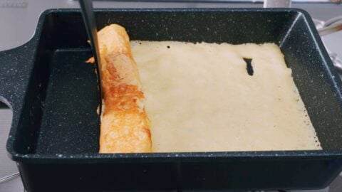 Rolling layers of tamagoyaki