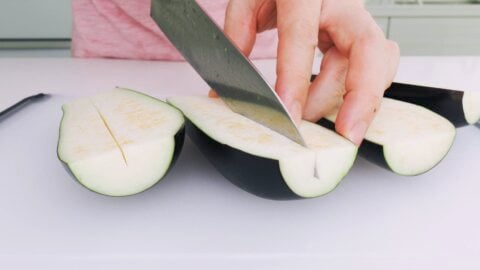 Cut a slit down the center of the eggplant.