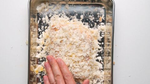 Breading a Wagyu Katsu in panko bread crumbs for making a Katsu Sandwich.