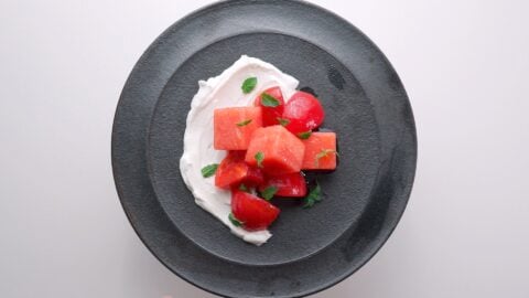 Mint, watermelon and tomato salad on a bed of labneh.