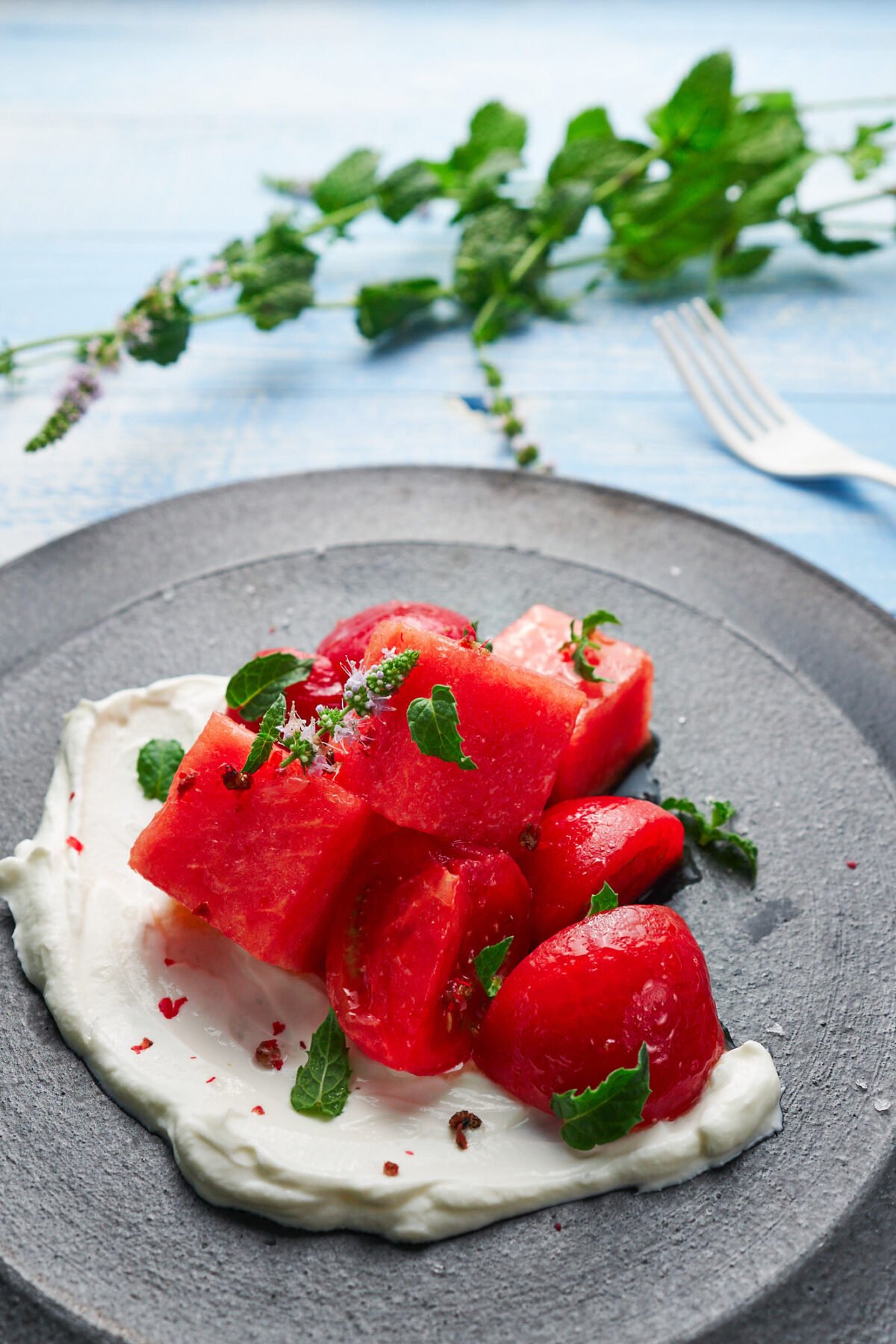 Crisp sweet watermelon, savory tomatoes and creamy labneh come together in this refreshing summer salad.