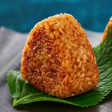 Grilled rice balls or yaki onigiri served wrapped with perilla leaves.