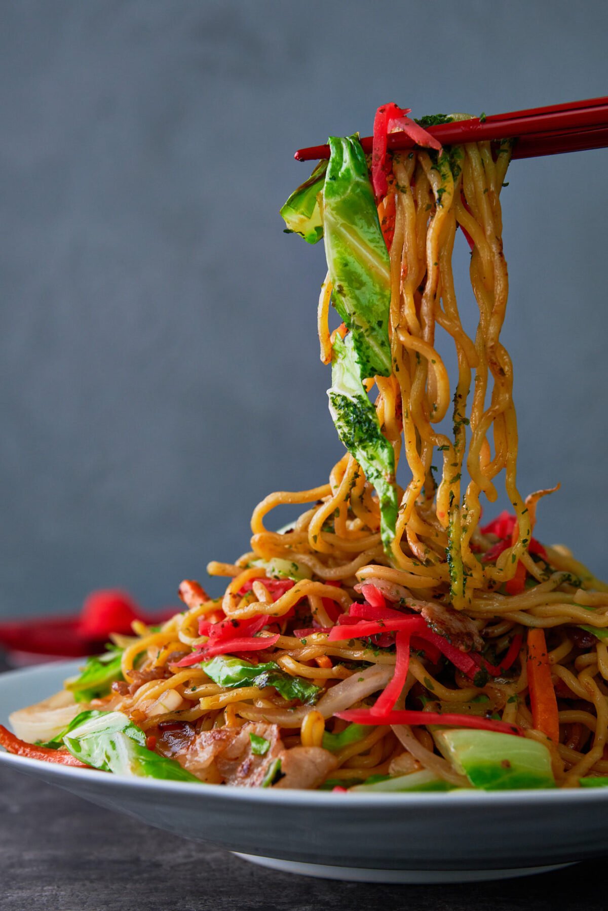 Long Chinese-style noodles stir-fried with cabbage, carrots and onions.