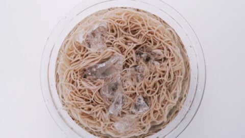 Chilling soba noodles in a bowl of ice water.