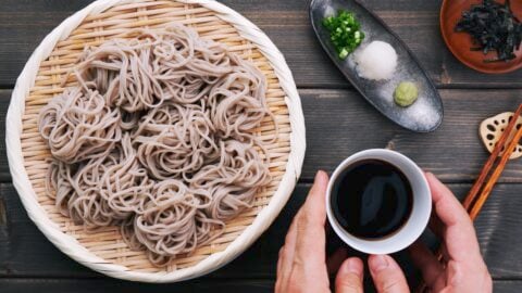 Serving Zaru Soba with dipping sauce and condiments.